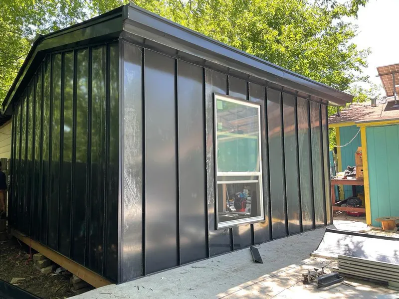 Black standing seam metal wall panels for Roof Inspection in Midlothian