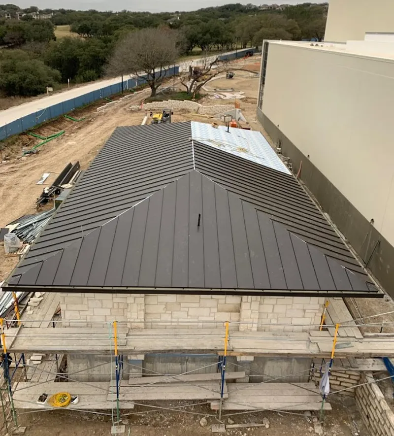 Metal roof new construction with scaffolding in Midlothian